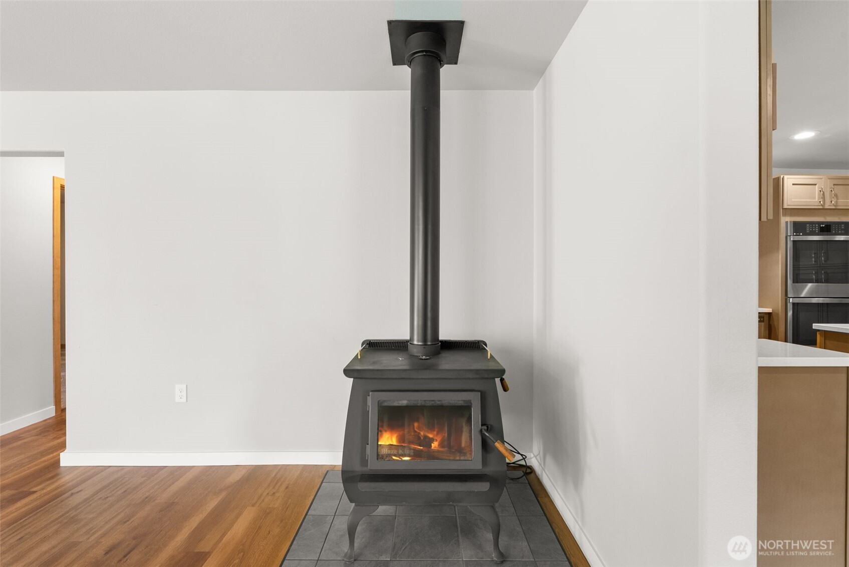 259-10 Tooley Road Toledo, WA 98591 - Photo 6 of 40 a view of a hallway with wooden floor and a fireplace