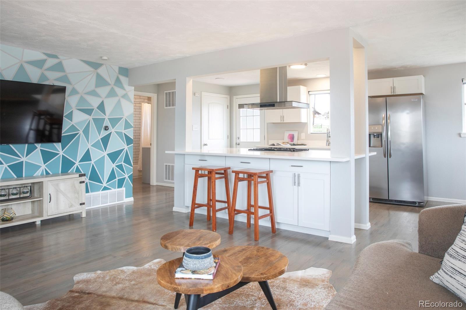 5380 Easley Road Golden, CO 80403 - Photo 13 of 38 a living room with furniture and a flat screen tv