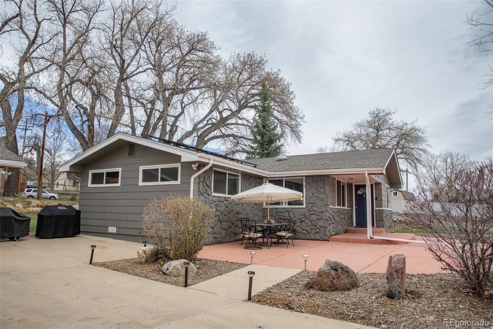 5380 Easley Road Golden, CO 80403 - Photo 2 of 38 a front view of a house with yard and seating space