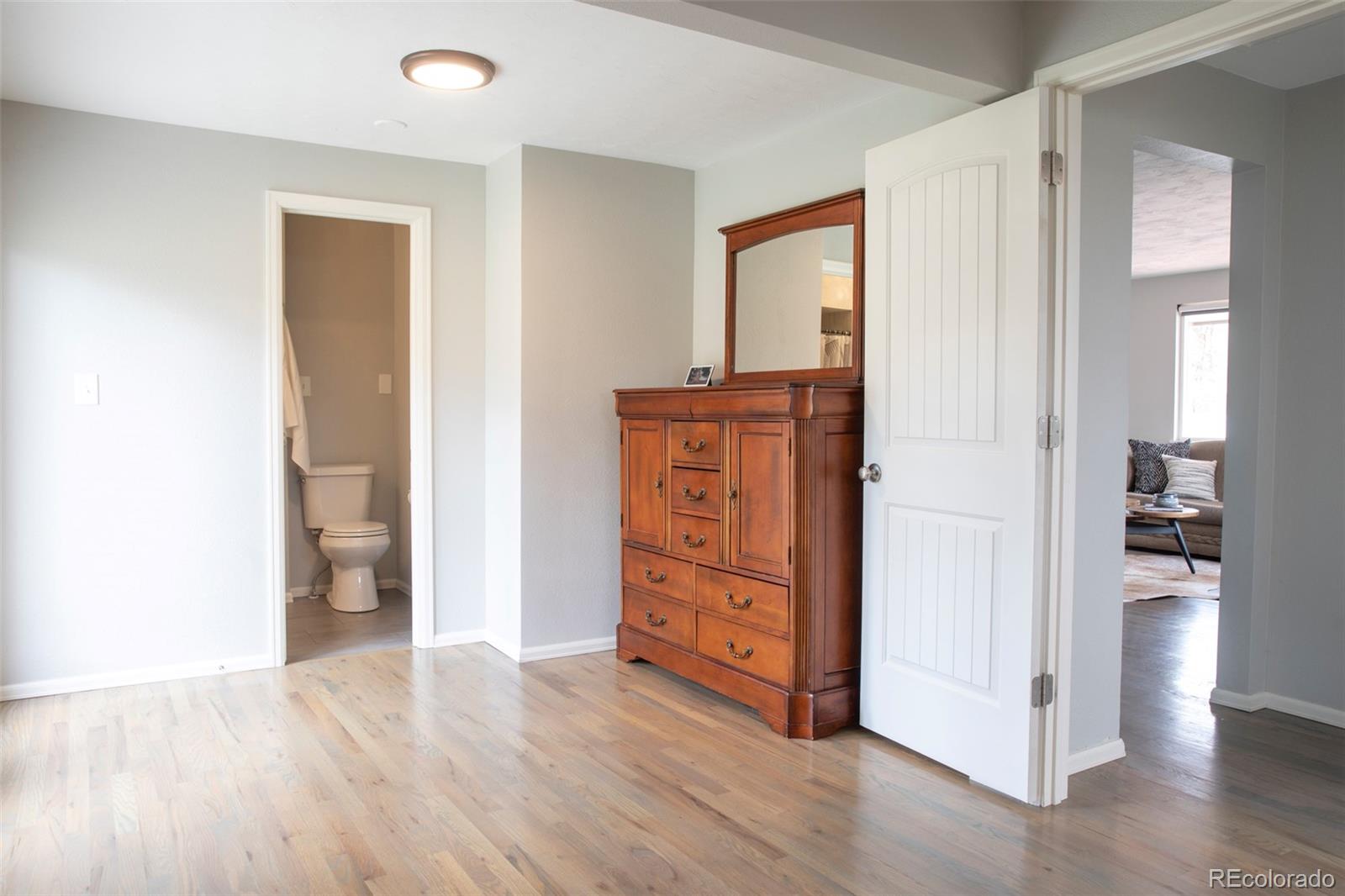 5380 Easley Road Golden, CO 80403 - Photo 22 of 38 wooden floor and windows in a room