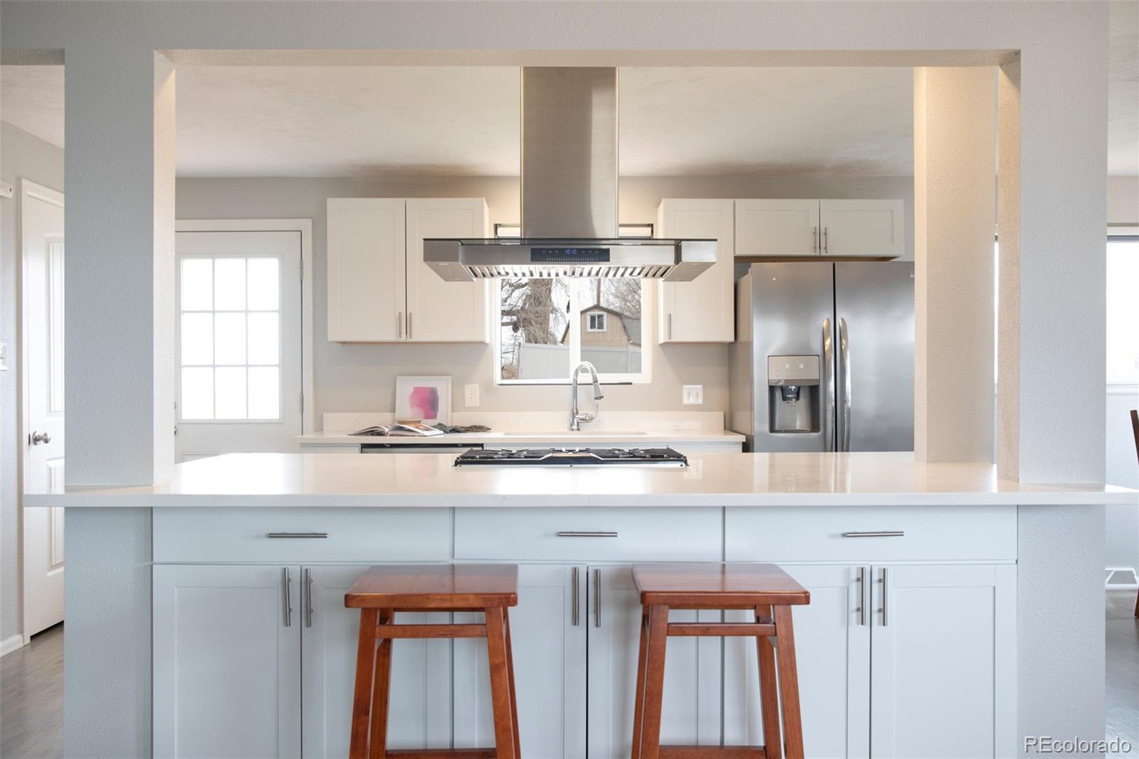 5380 Easley Road Golden, CO 80403 - Photo 4 of 38 a kitchen with stainless steel appliances a sink and a window