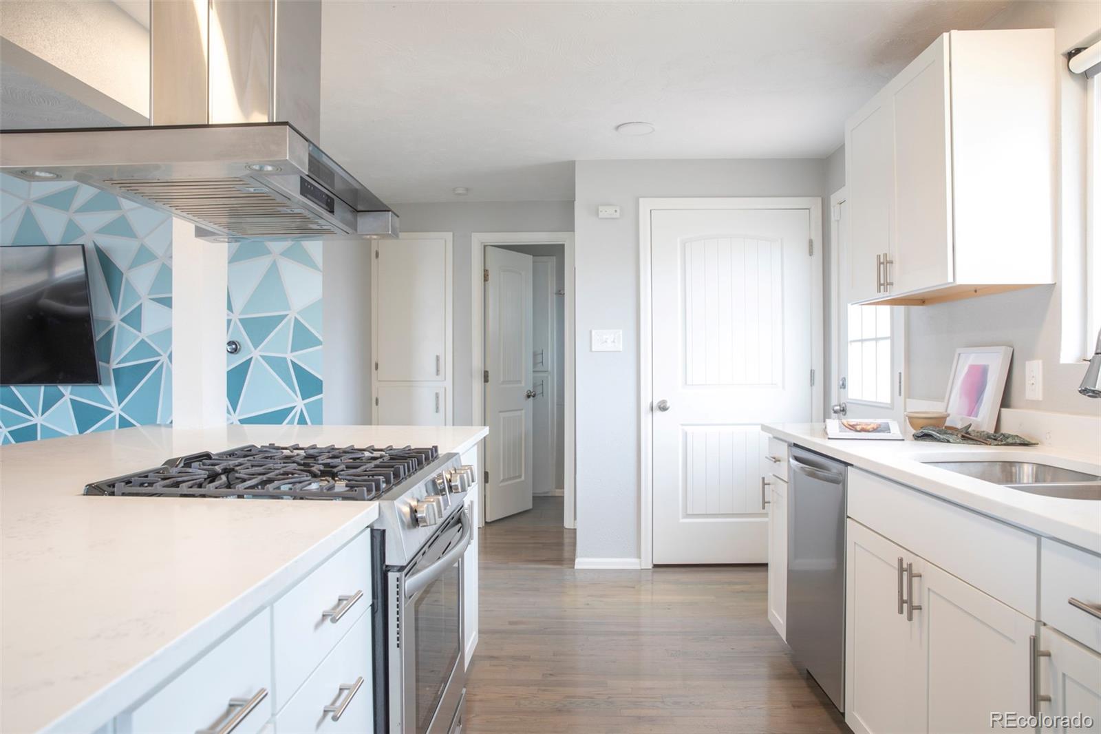 5380 Easley Road Golden, CO 80403 - Photo 8 of 38 a kitchen with a sink stove and cabinets
