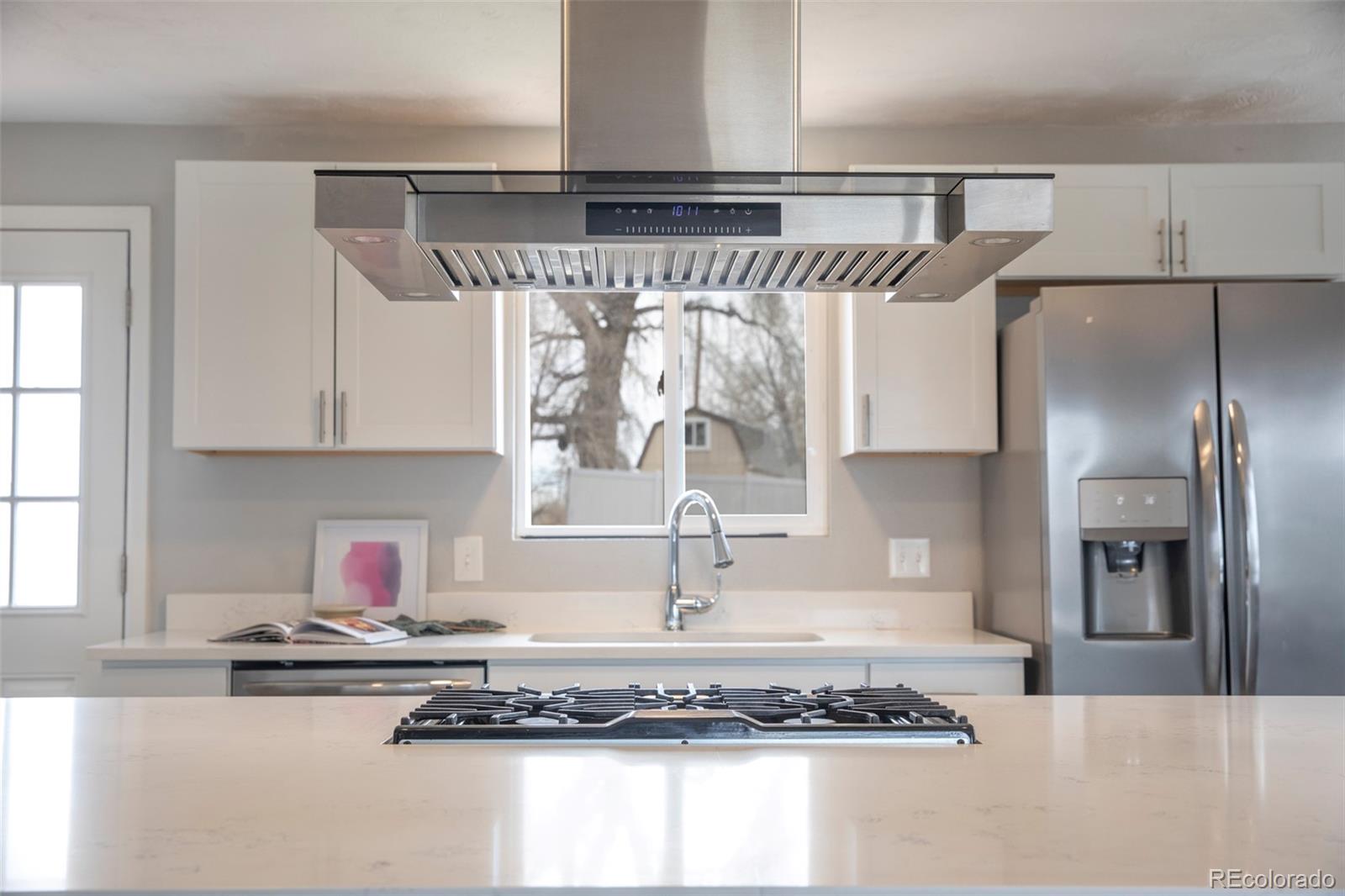 5380 Easley Road Golden, CO 80403 - Photo 9 of 38 a kitchen with a refrigerator and a sink