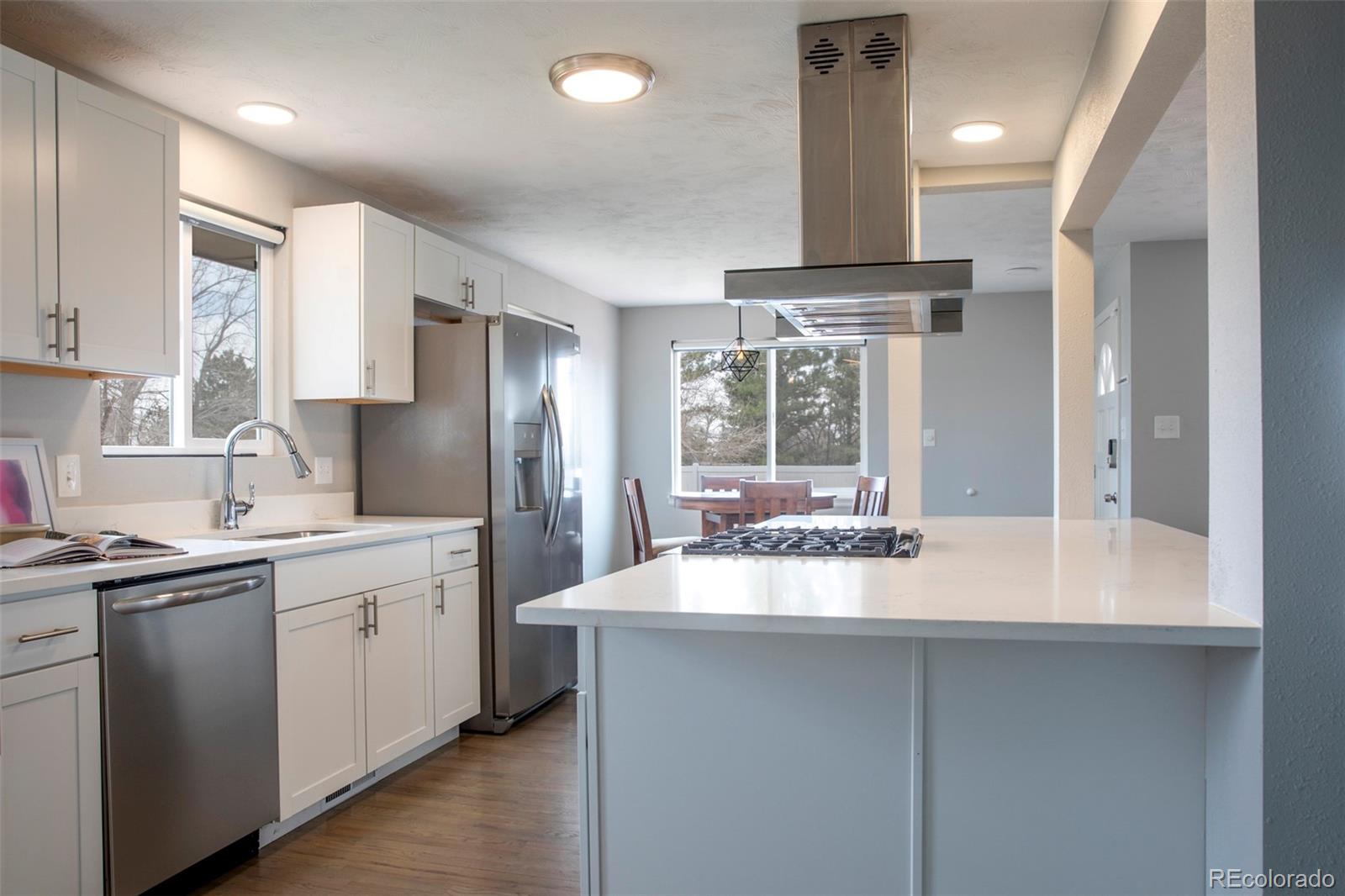 5380 Easley Road Golden, CO 80403 - Photo 10 of 38 a kitchen with a sink stove and refrigerator