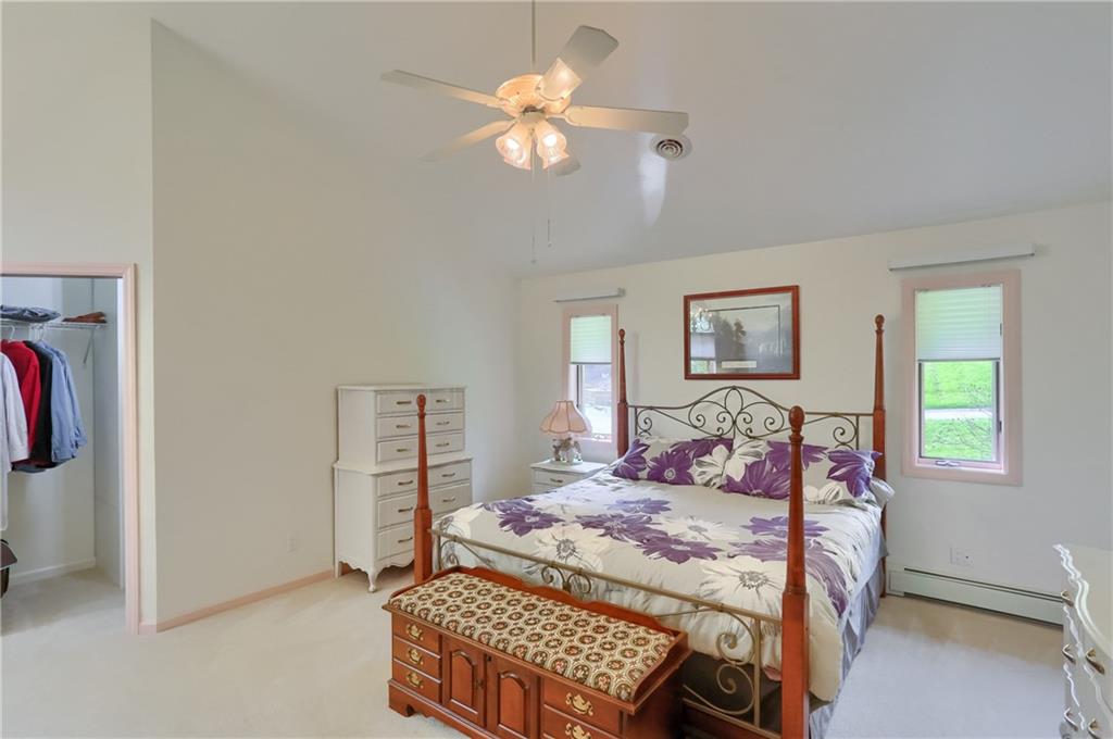 481 Chicora Fenelton Road Chicora, PA 16025 - Photo 20 of 50 a bedroom with a bed and a chandelier