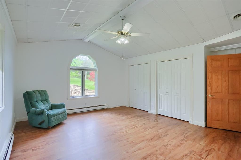 481 Chicora Fenelton Road Chicora, PA 16025 - Photo 23 of 50 an empty room with windows and ceiling fan
