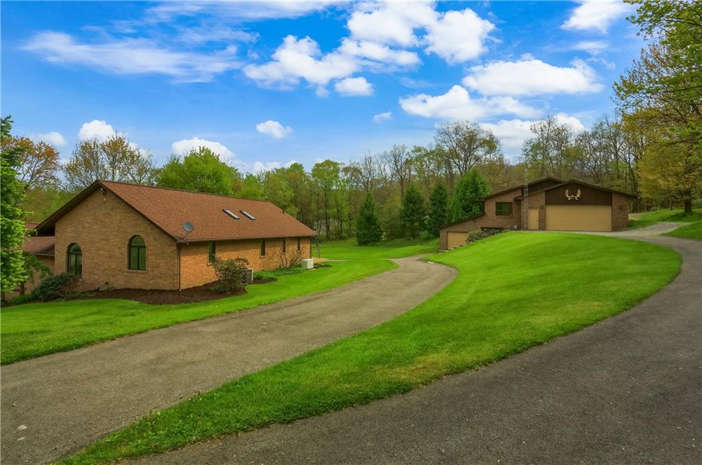 481 Chicora Fenelton Road Chicora, PA 16025 - Photo 40 of 50 a house with green field in front of it