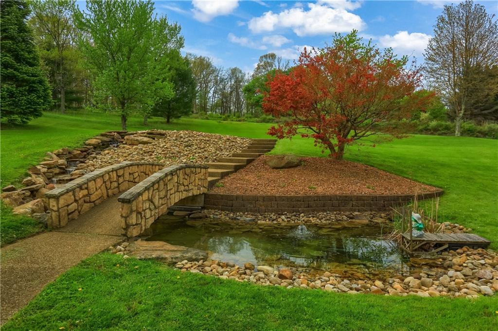 481 Chicora Fenelton Road Chicora, PA 16025 - Photo 43 of 50 a view of a garden with a lake