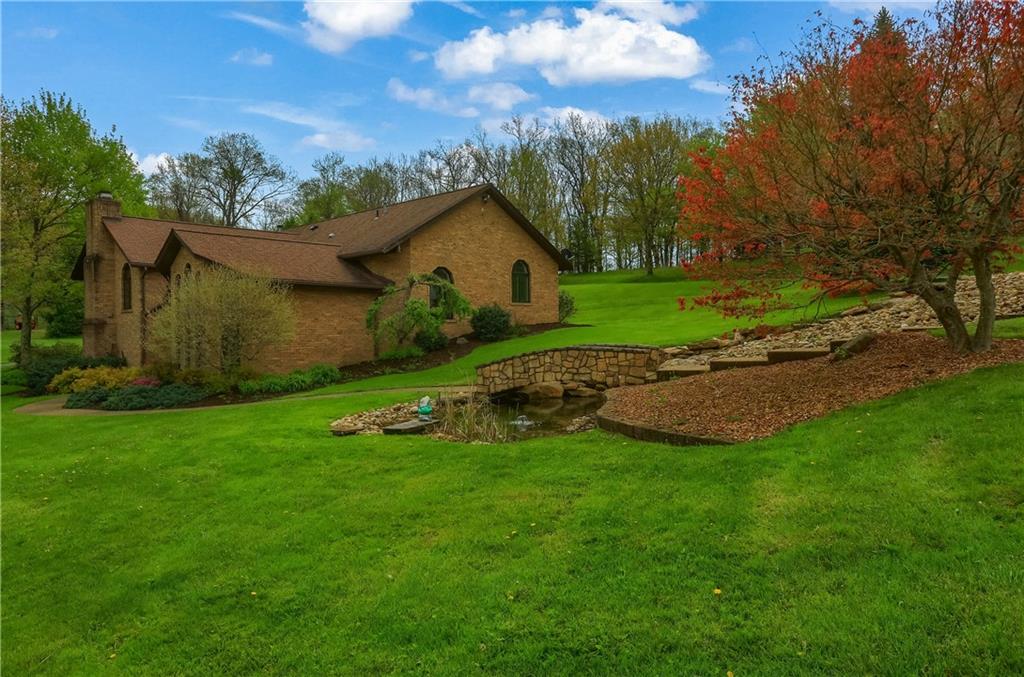 481 Chicora Fenelton Road Chicora, PA 16025 - Photo 45 of 50 a view of a house with a big yard and potted plants