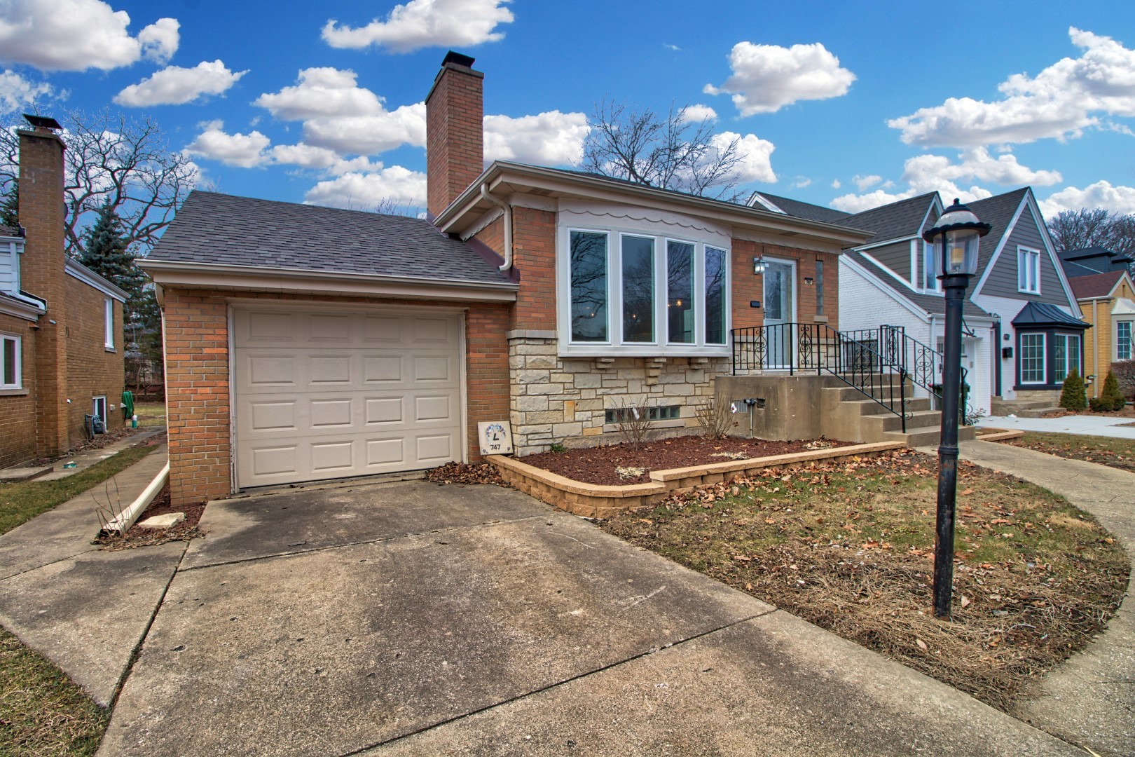 747 Arlington Road Riverside, IL 60546 - Photo 2 of 16 a front view of a house with garden