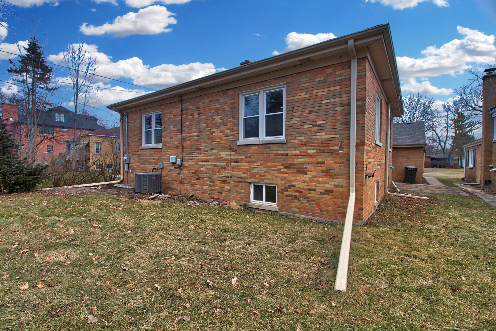 747 Arlington Road Riverside, IL 60546 - Photo 16 of 16 a brick house with a yard and parking space