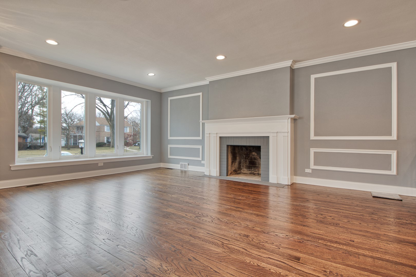 747 Arlington Road Riverside, IL 60546 - Photo 3 of 16 a view of an empty room with wooden floor and a window