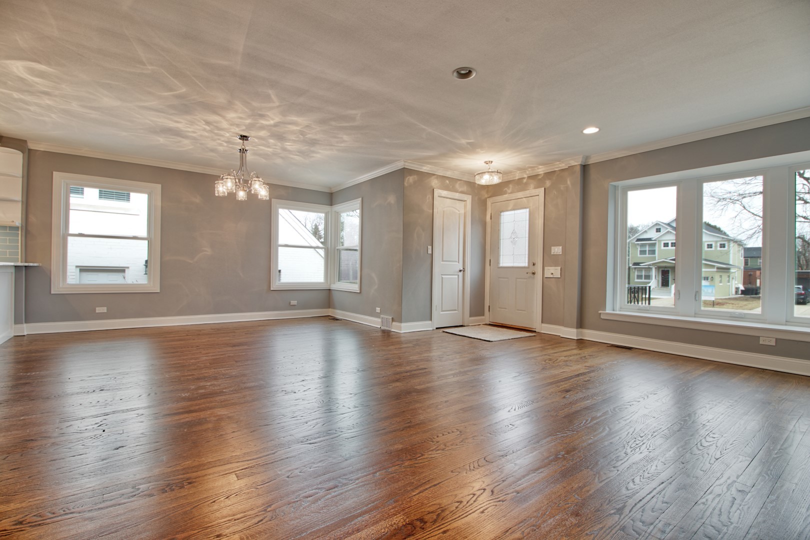 747 Arlington Road Riverside, IL 60546 - Photo 4 of 16 an empty room with wooden floor and windows