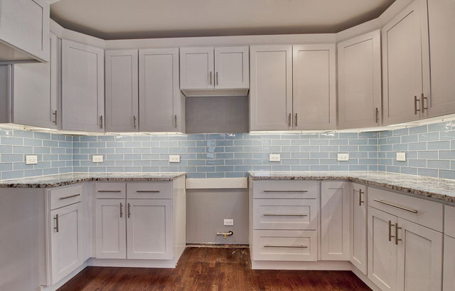 747 Arlington Road Riverside, IL 60546 - Photo 5 of 16 a kitchen with appliances cabinets and a sink