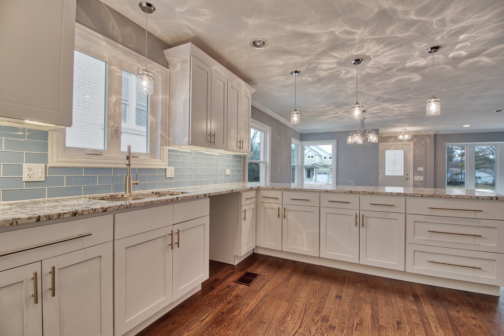 747 Arlington Road Riverside, IL 60546 - Photo 6 of 16 a kitchen with granite countertop white cabinets and white appliances