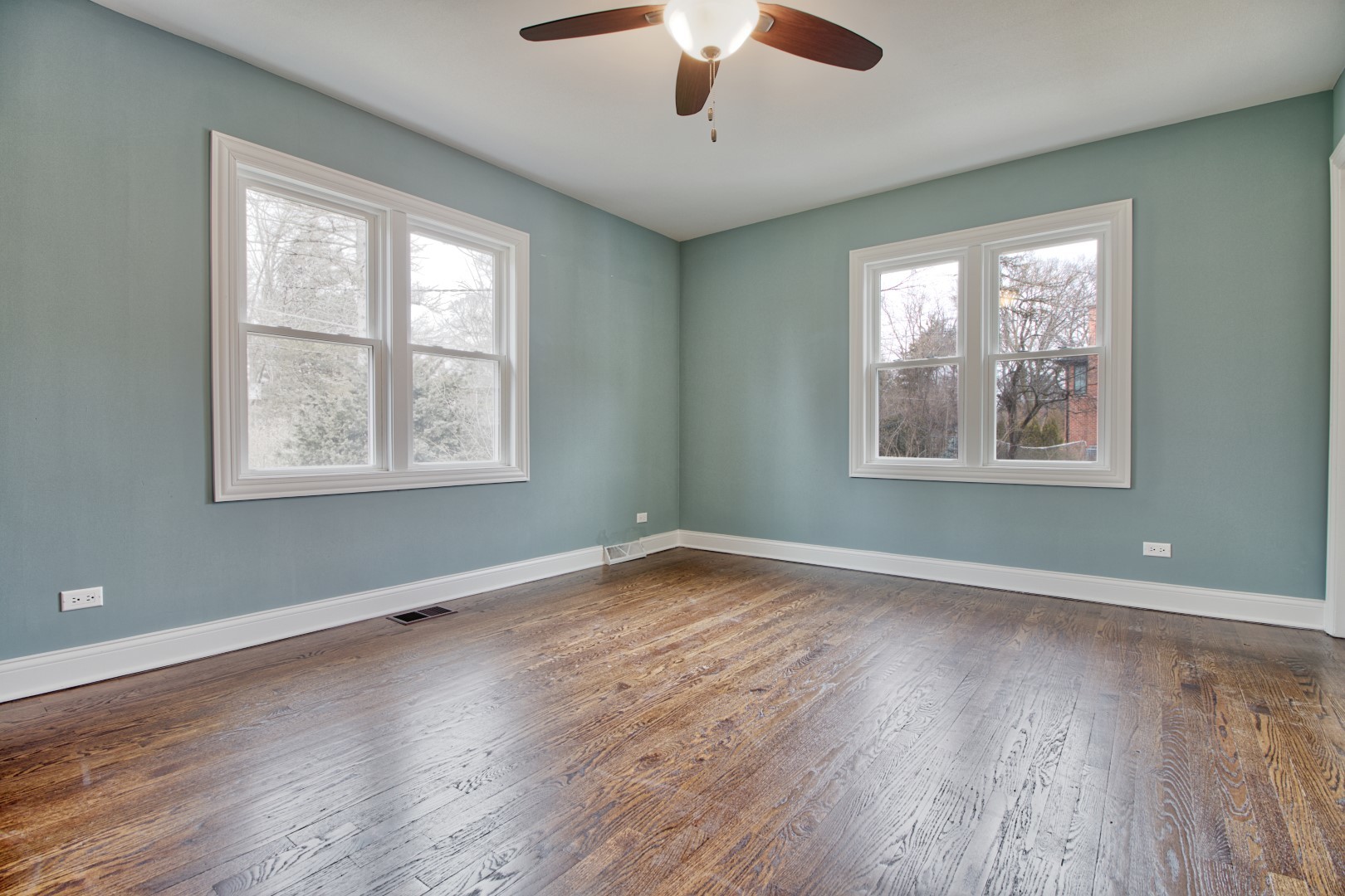 747 Arlington Road Riverside, IL 60546 - Photo 9 of 16 a view of an empty room with wooden floor and a window