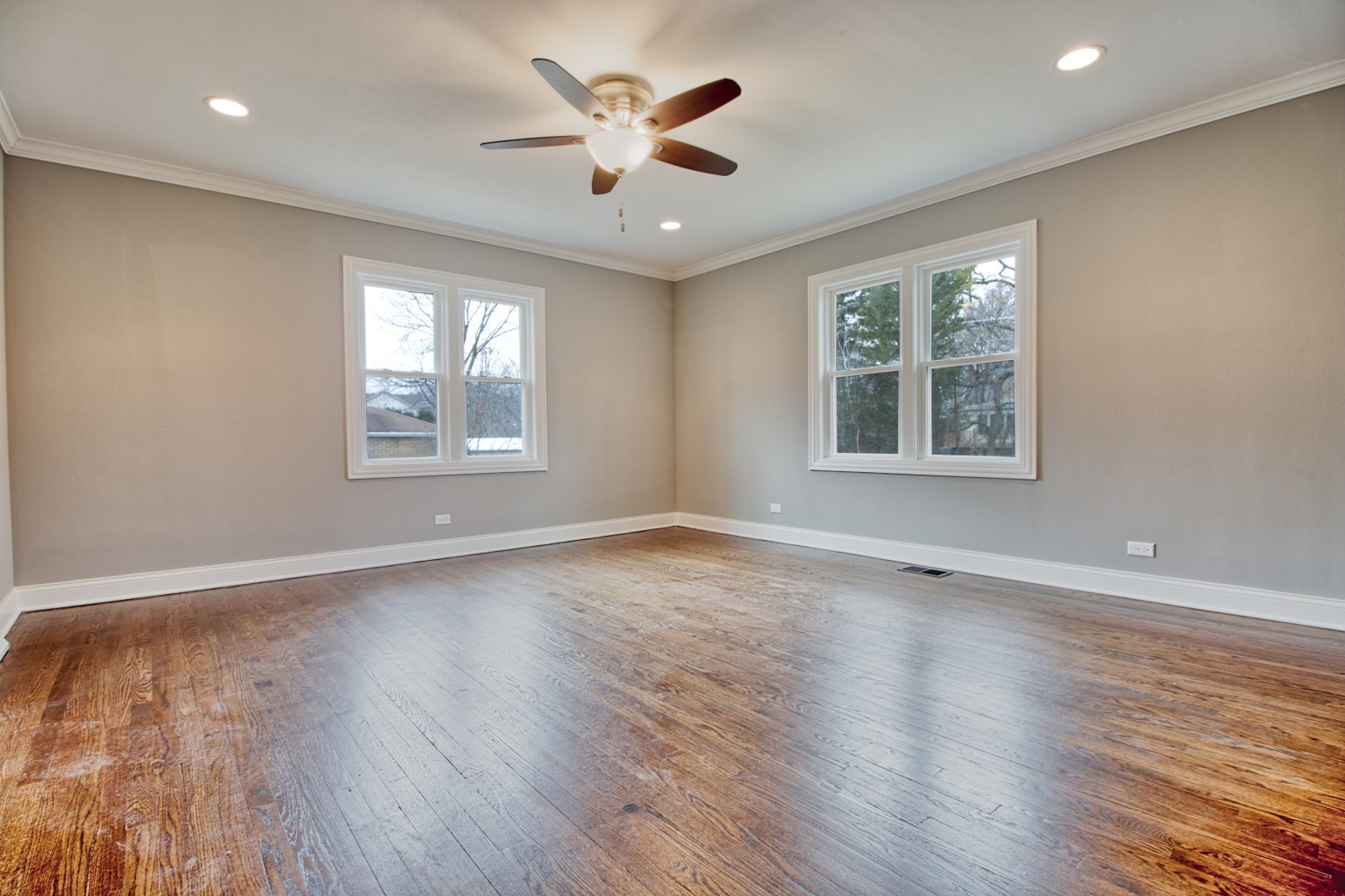 747 Arlington Road Riverside, IL 60546 - Photo 10 of 16 an empty room with wooden floor and windows