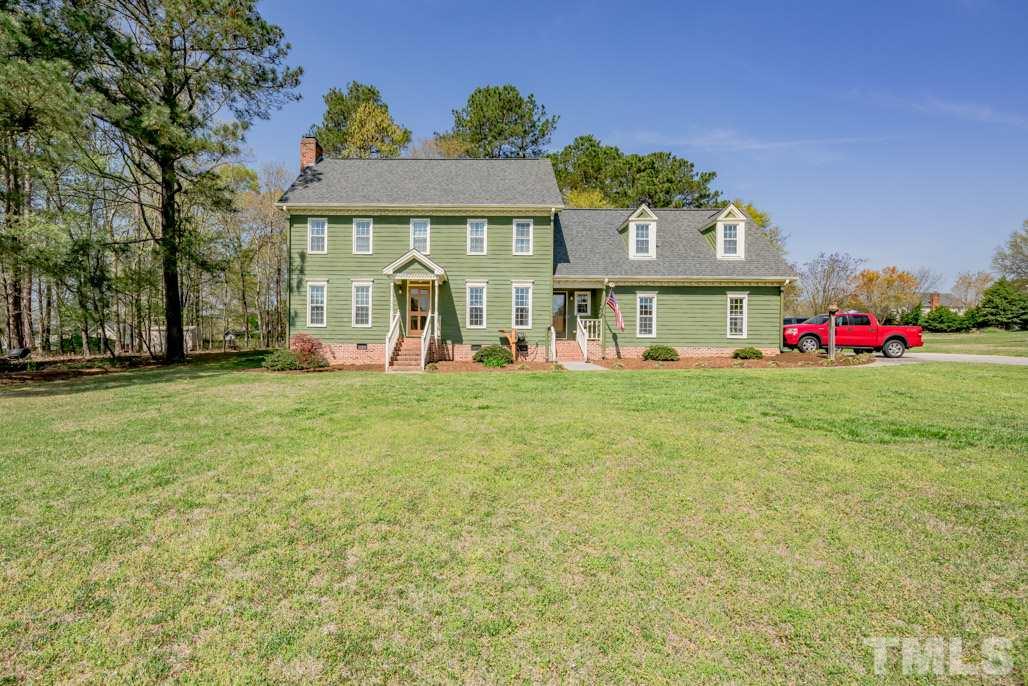 6108 Wolverhampton Drive Raleigh, NC 27603 - Photo 1 of 30 a front view of a house with garden