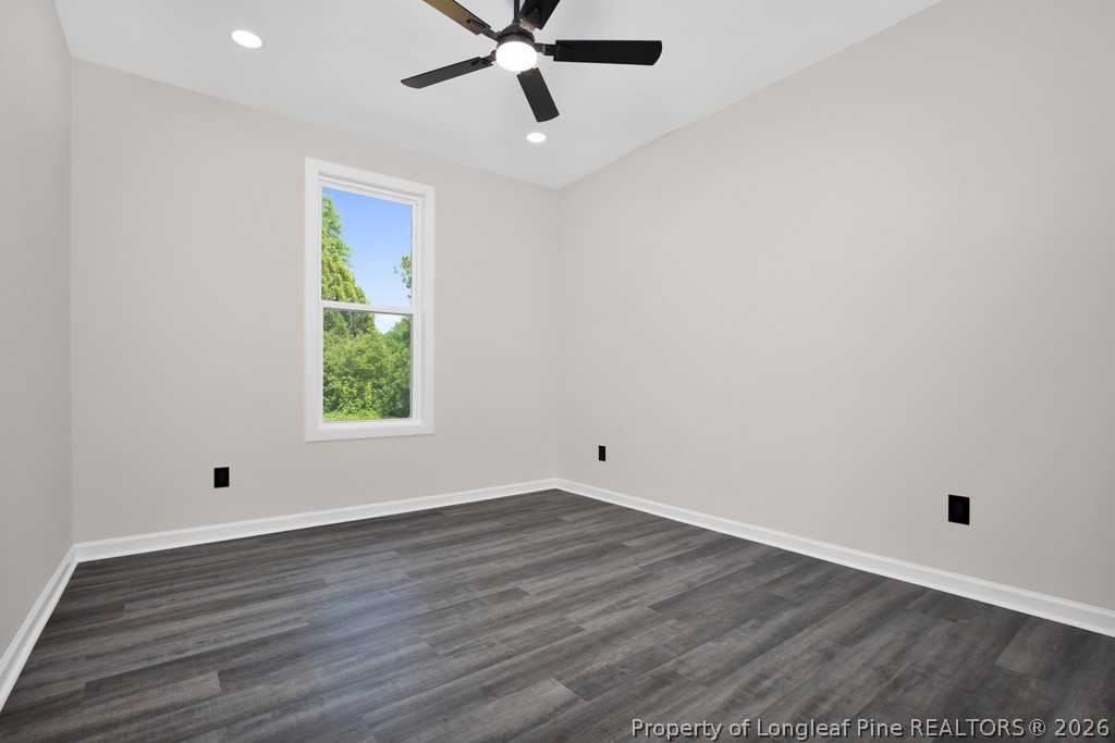 3025 Old Stage Road South Erwin, NC 28339 - Photo 32 of 50 an empty room with wooden floor and windows