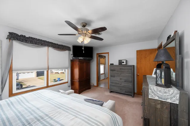 a bedroom with a bed and furniture