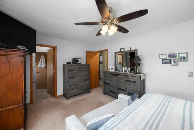 a bathroom with a sink mirror and vanity