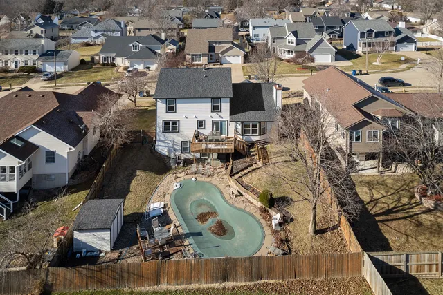 an aerial view of a house with outdoor space