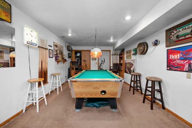 a bedroom with a bed couch and a window