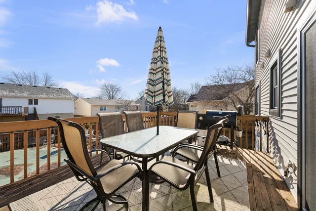 a view of a chairs and table in patio