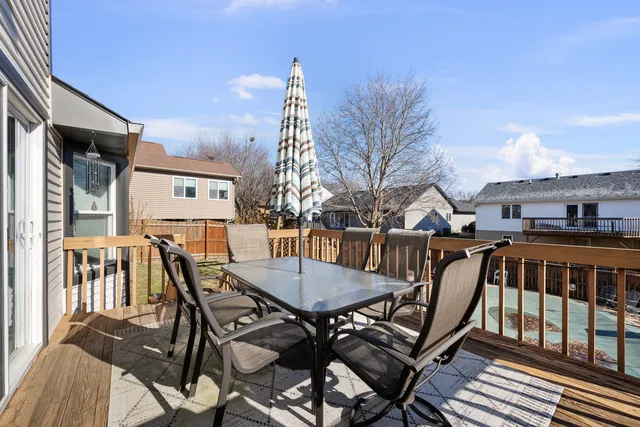a view of a backyard with sitting area