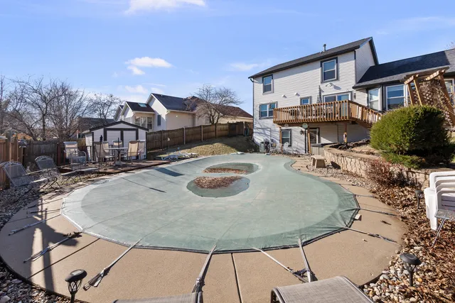 a view of a patio with swimming pool table and chairs