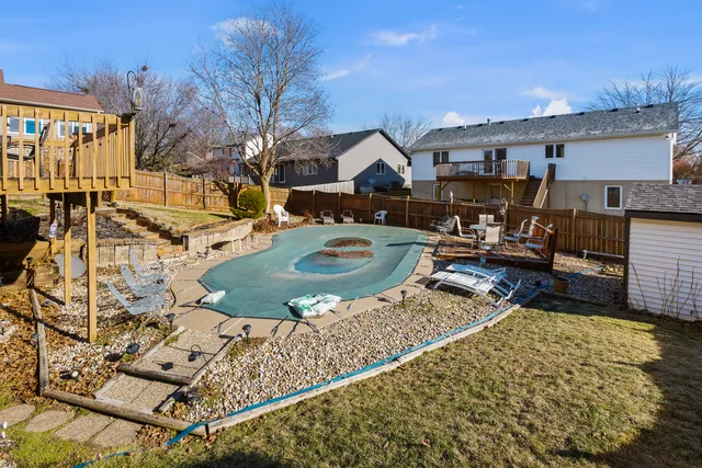 a view of a balcony with furniture and front door