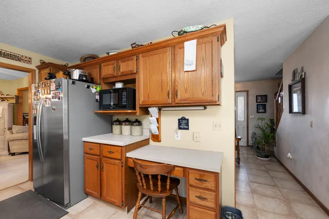 a kitchen with stainless steel appliances a sink stove and refrigerator