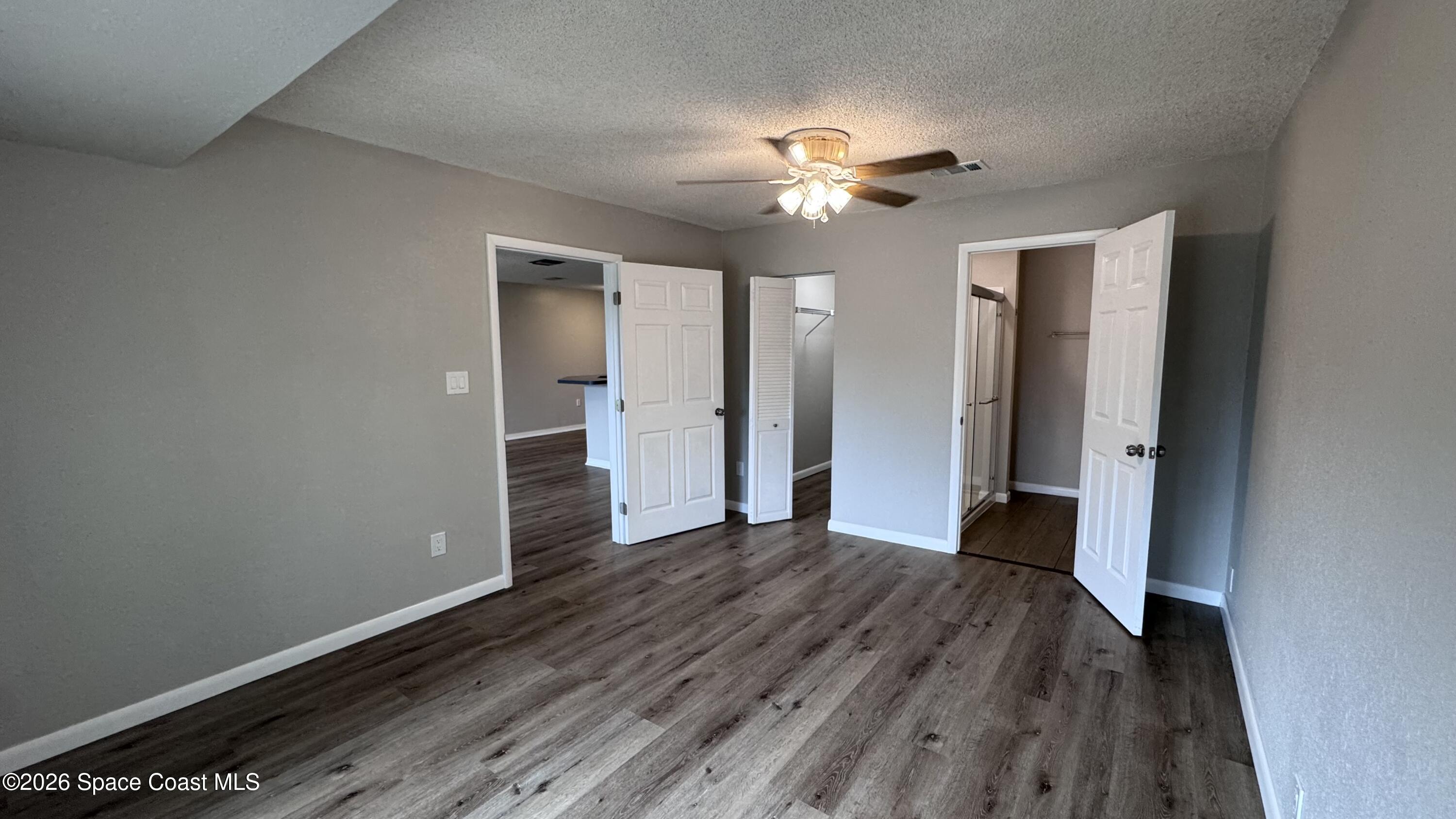 2137 Laden Road Melbourne, FL 32935 - Photo 8 of 23 a view of an empty room with wooden floor