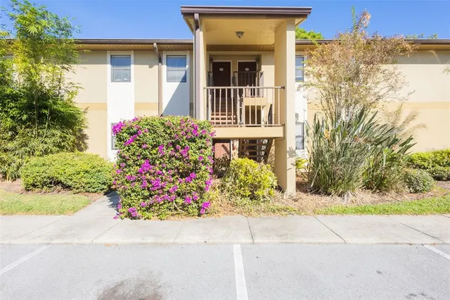 a front view of a house with a yard and a garage