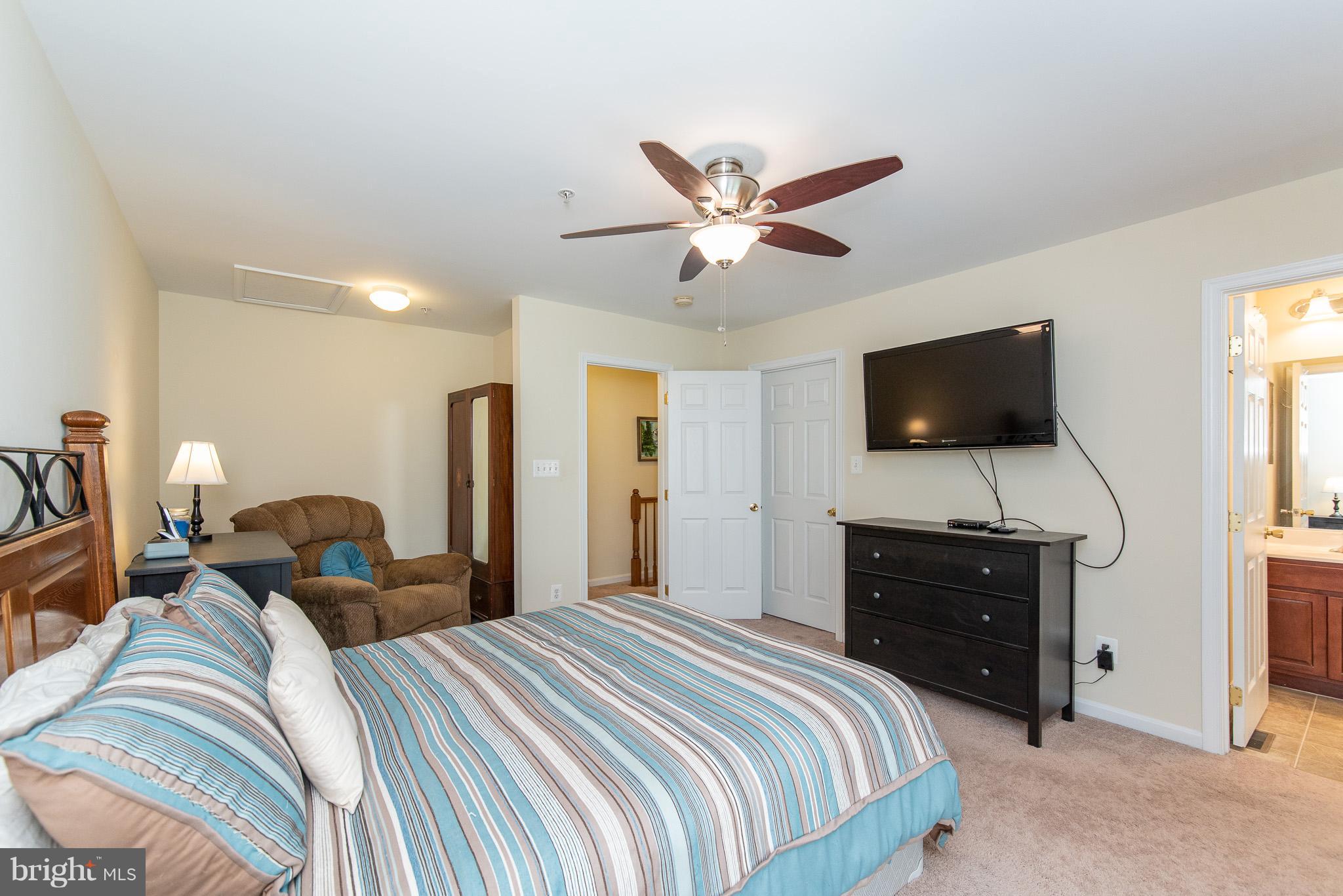 1707 Waltman Road Edgewood, MD 21040 - Photo 14 of 30 a bedroom with a bed and a flat screen tv