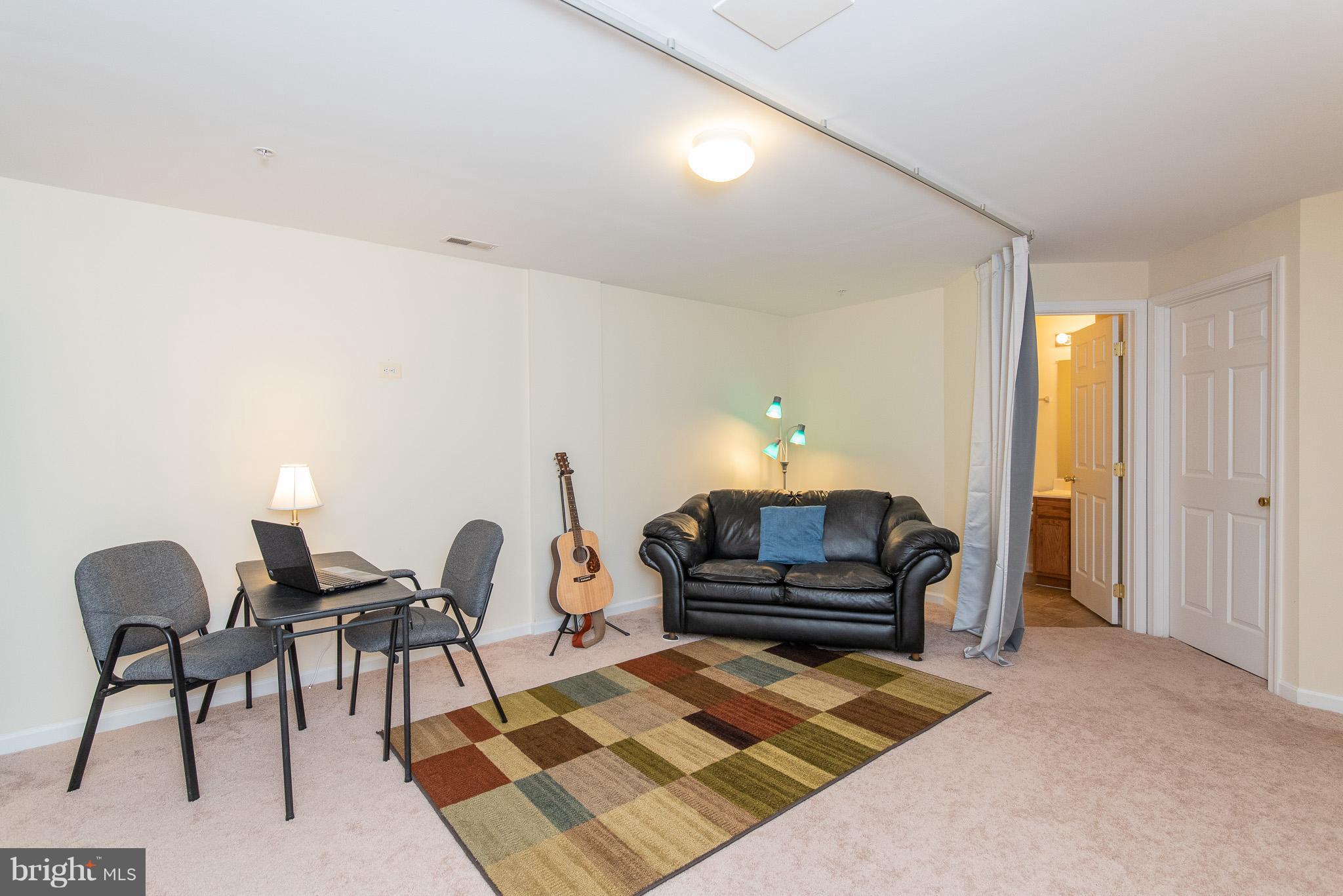 1707 Waltman Road Edgewood, MD 21040 - Photo 22 of 30 a living room with furniture and a rug