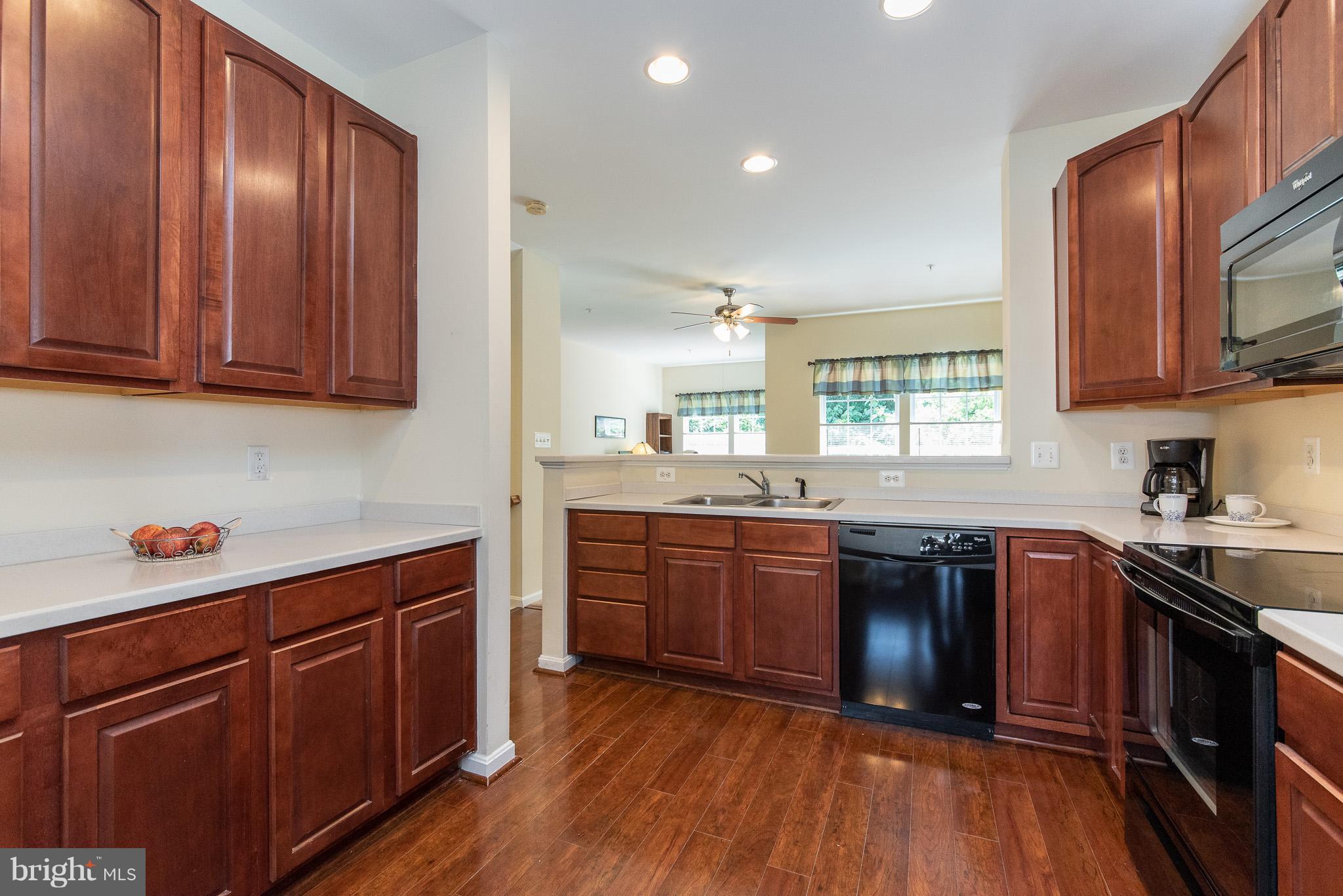 1707 Waltman Road Edgewood, MD 21040 - Photo 5 of 30 a kitchen with stainless steel appliances granite countertop wooden cabinets and a stove top oven