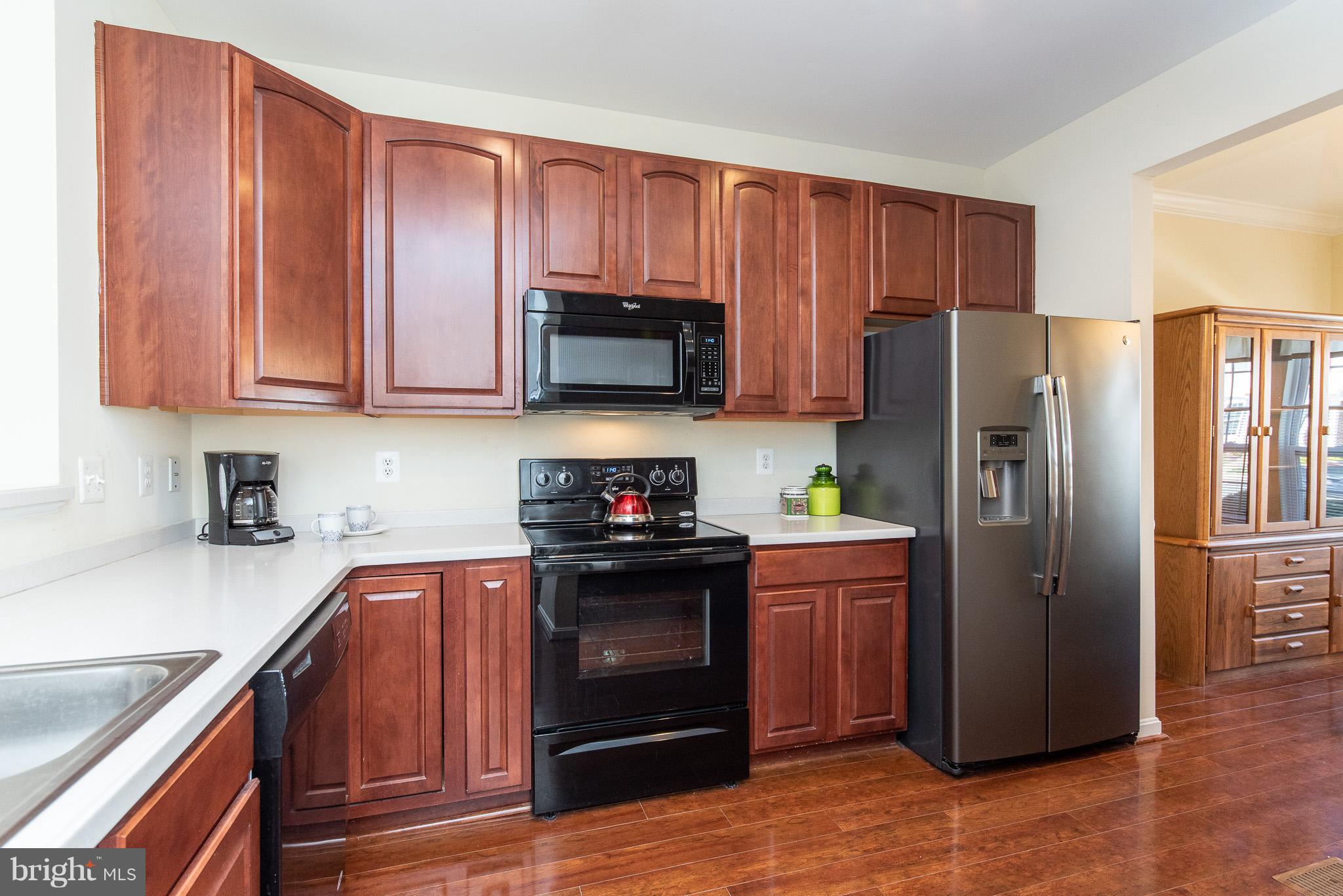 1707 Waltman Road Edgewood, MD 21040 - Photo 7 of 30 a kitchen with stainless steel appliances granite countertop a refrigerator stove and sink