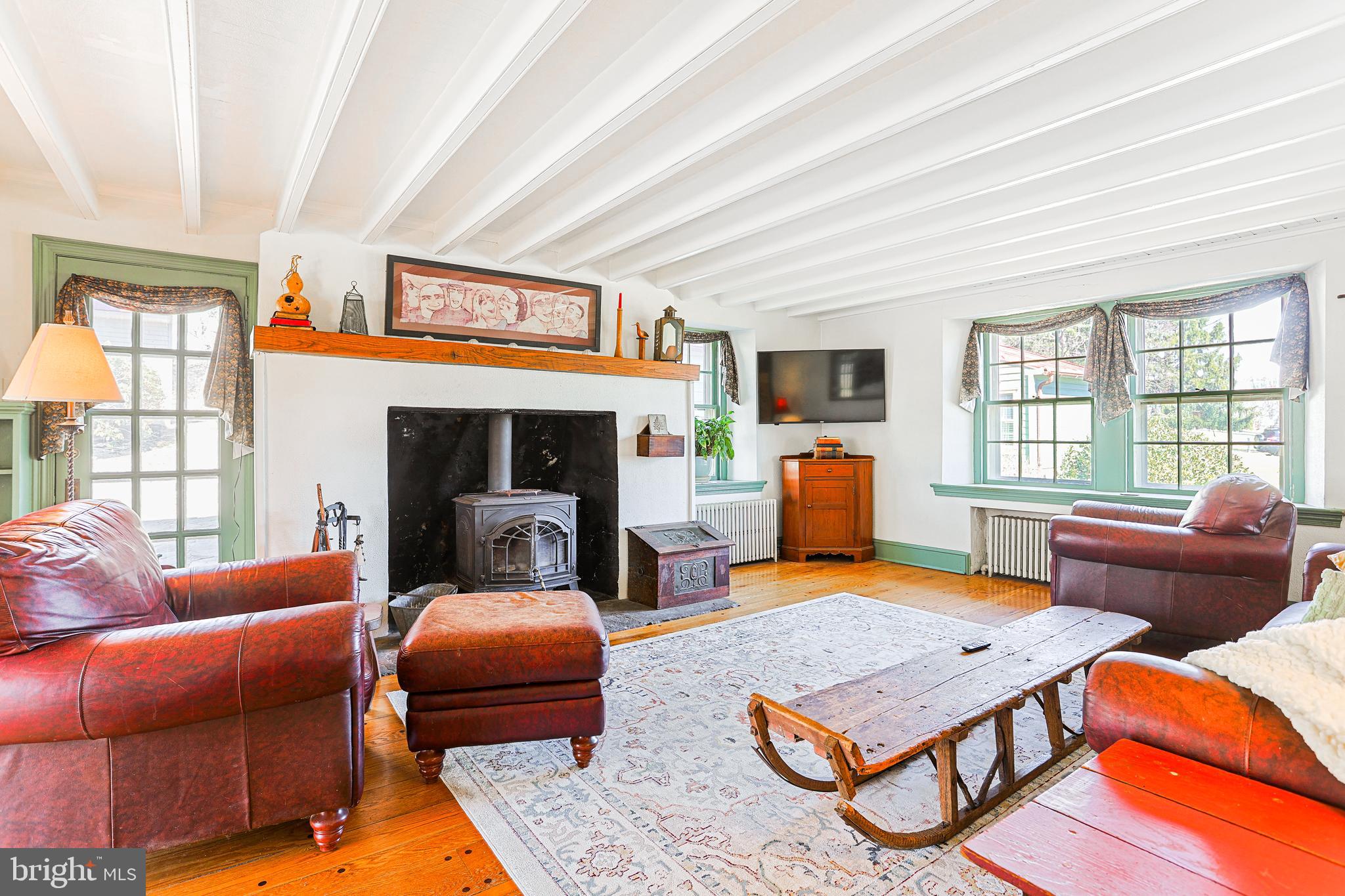 38 Devyn Drive Chester Springs, PA 19425 - Photo 5 of 40 a living room with furniture a flat screen tv and a fireplace