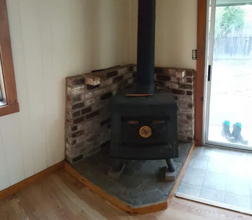 view of living room with a fireplace