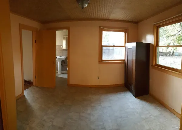 an empty room with windows