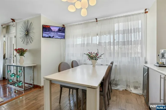 a kitchen with stainless steel appliances a refrigerator sink and cabinets