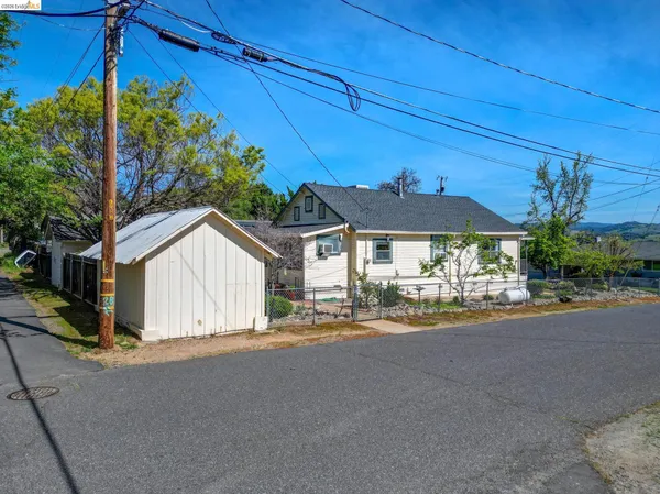 a view of a house with a street