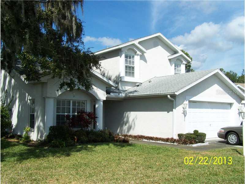 11443 Short Court New Port Richey, FL 34654 - Photo 1 of 1 a front view of a house with a garden