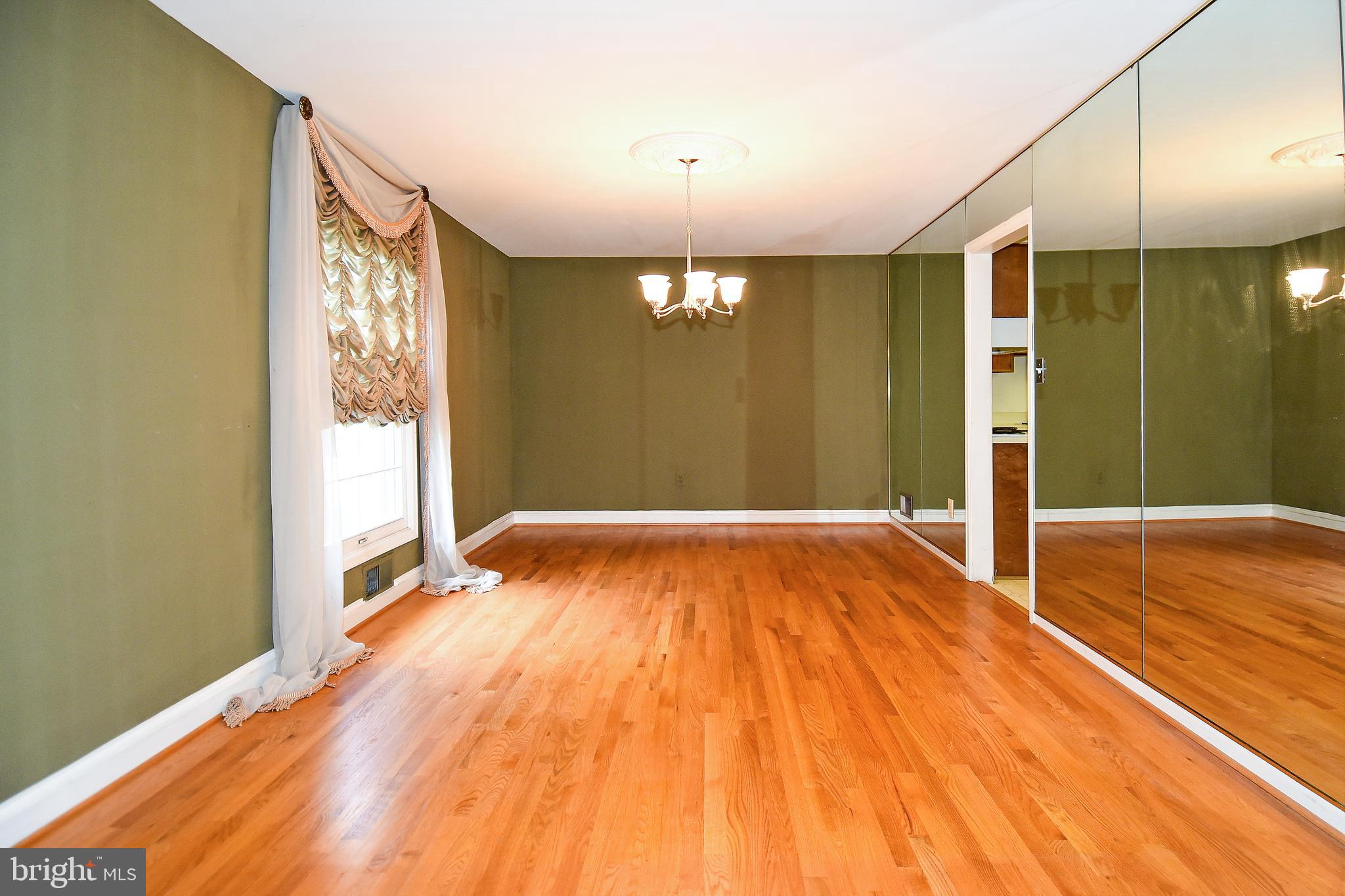 12703 Hammonton Road Silver Spring, MD 20904 - Photo 14 of 63 FORMAL DINING ROOM WITH NEWER OAK FLOORS