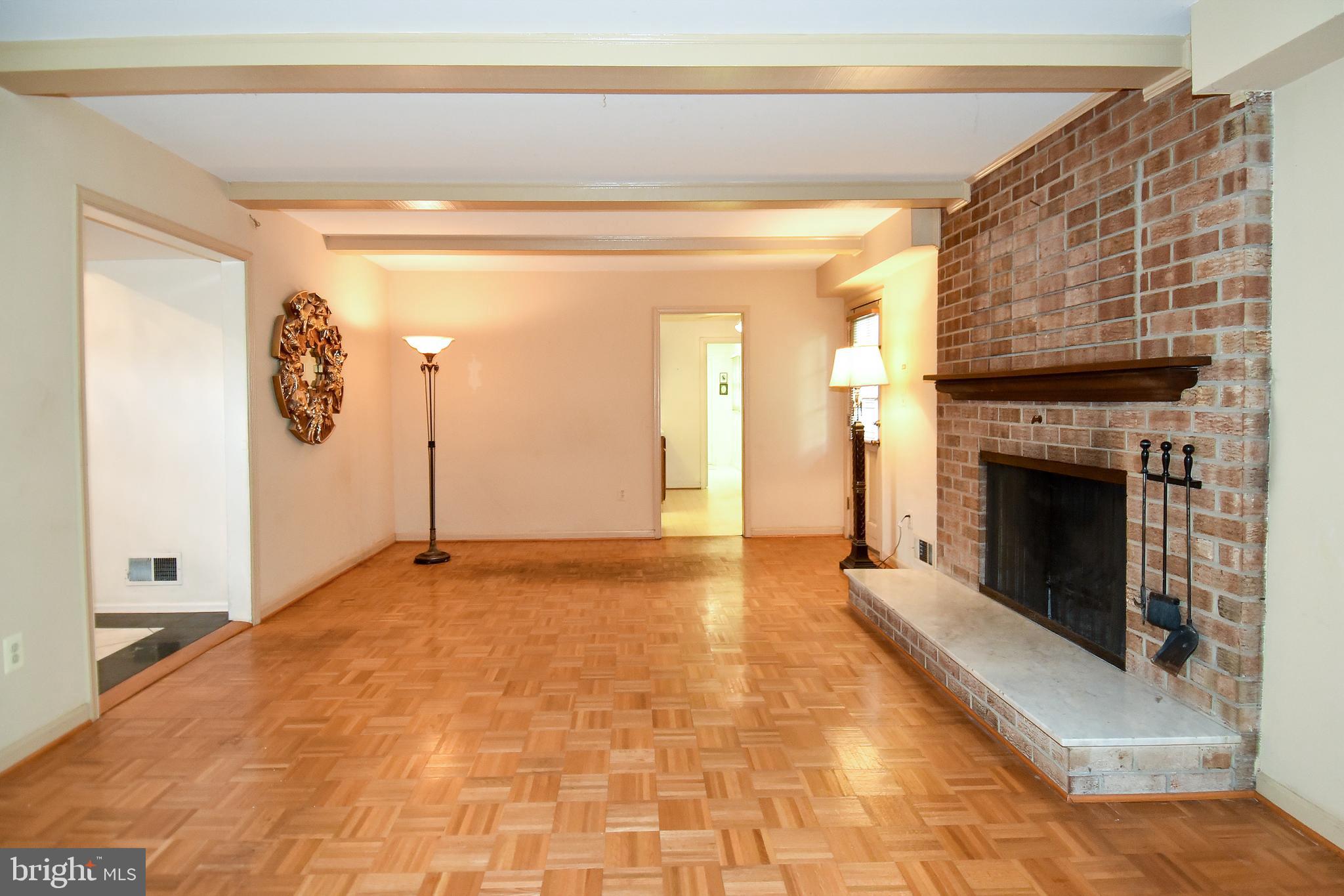 12703 Hammonton Road Silver Spring, MD 20904 - Photo 24 of 63 MAIN LEVEL FAMILY ROOM HAS WOOD BURNING FIREPLACE