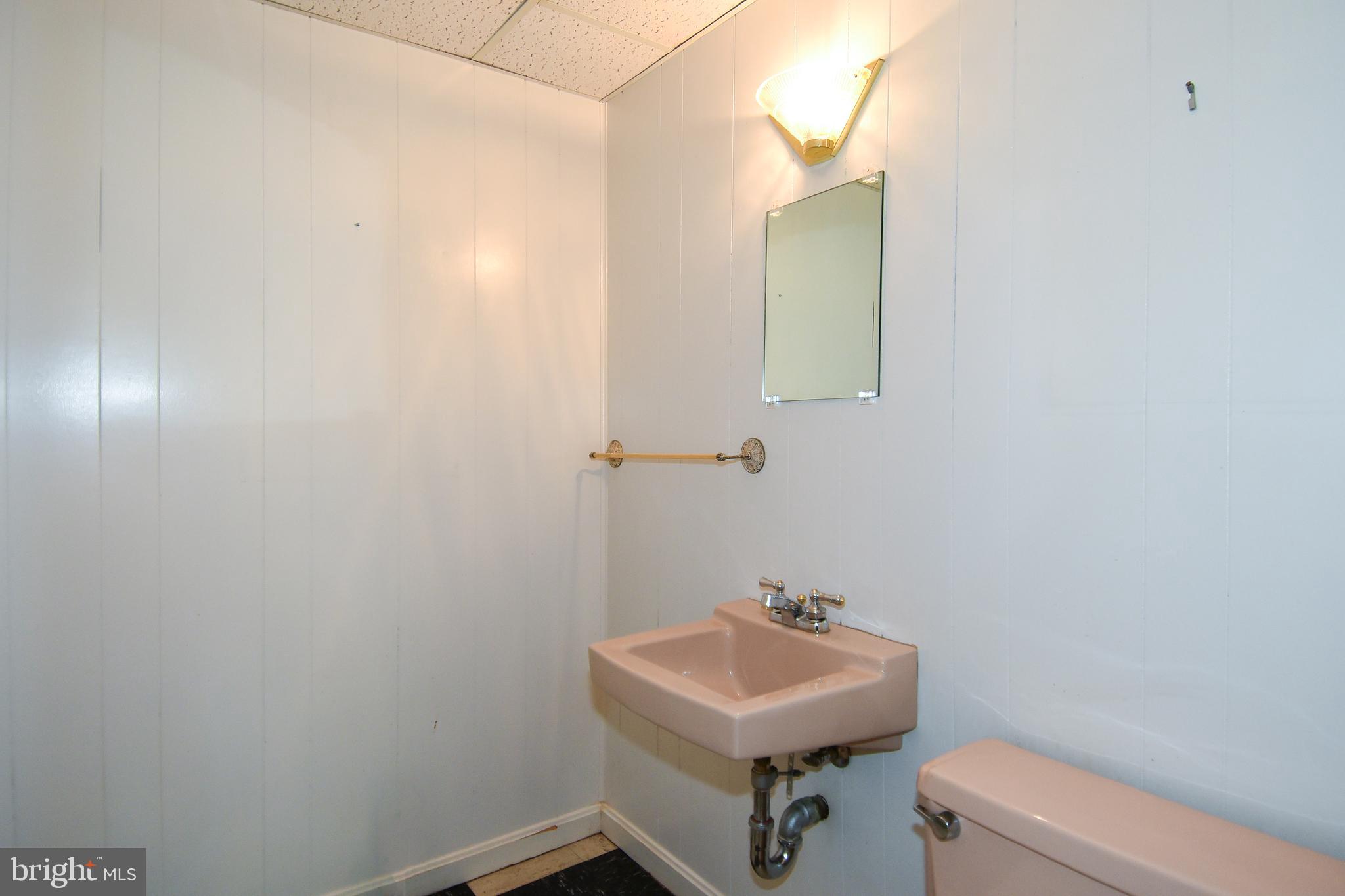 12703 Hammonton Road Silver Spring, MD 20904 - Photo 54 of 63 LOWER LEVEL POWDER RM CAN BE MADE INTO FULL BATH