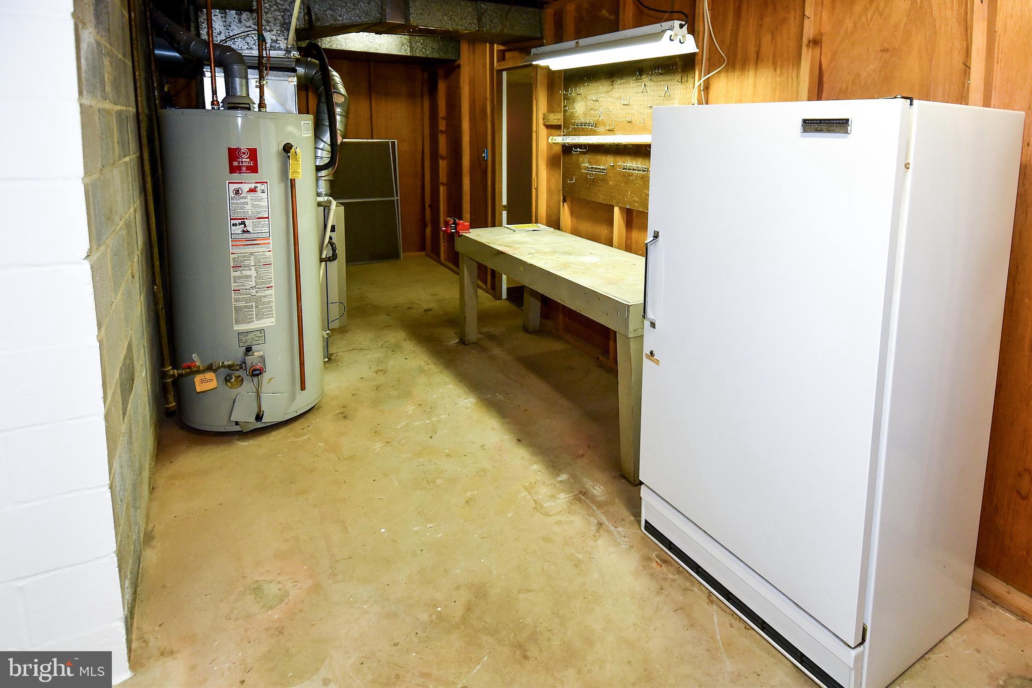 12703 Hammonton Road Silver Spring, MD 20904 - Photo 56 of 63 STORAGE ROOM WITH WORK BENCH