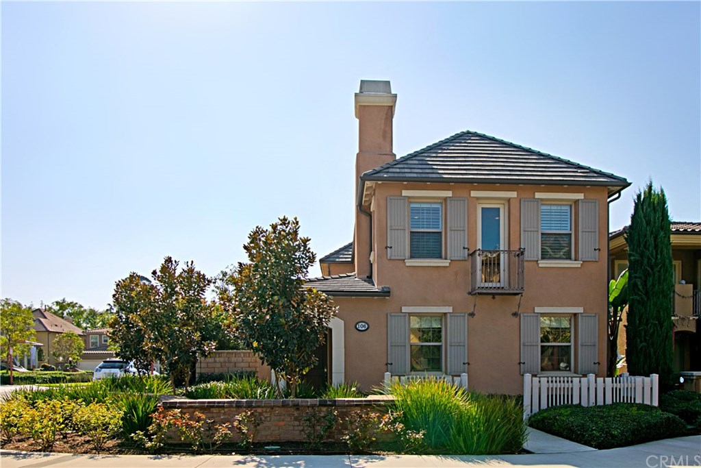 Front view of this gorgeous detached condo, sideyard is on left behind trees.