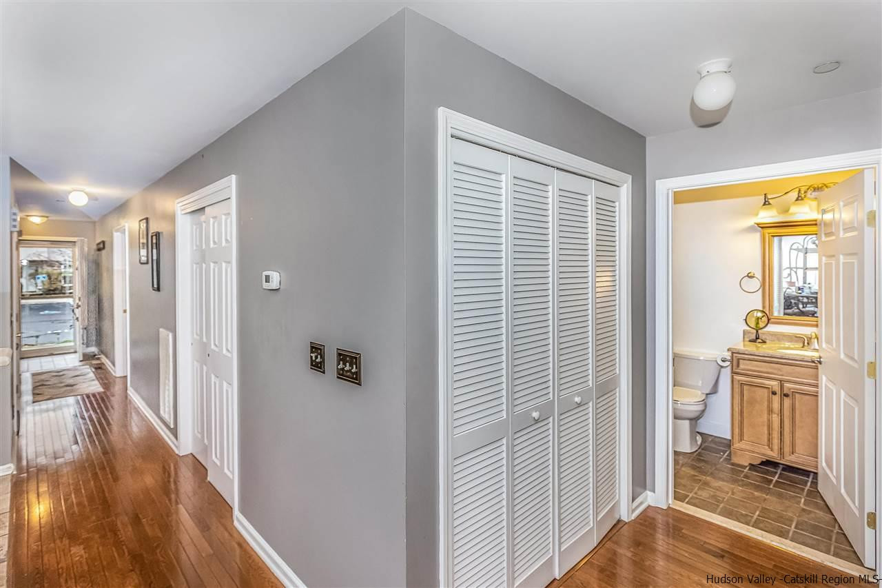 1129 Maggie Road Newburgh, NY 12550 - Photo 12 of 28 a view of a hallway with wooden floor and a living room